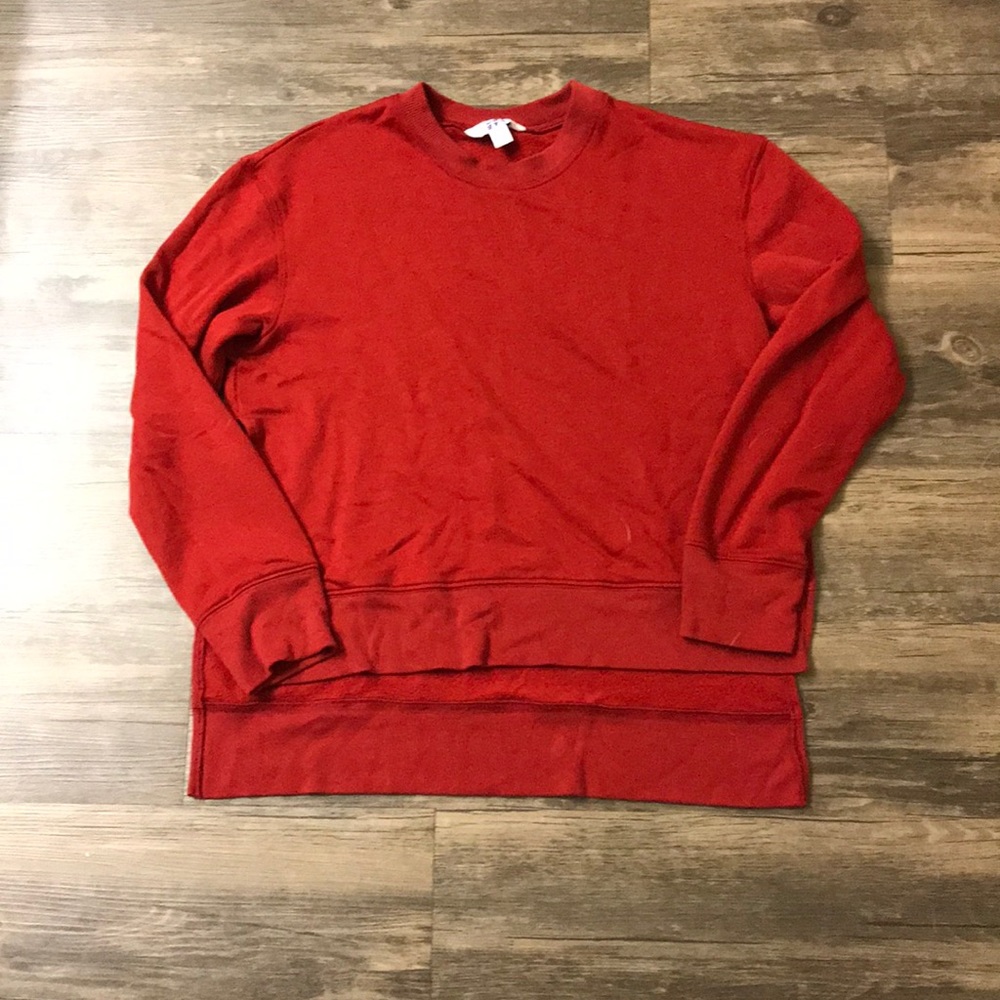 Red sweatshirt with side slits